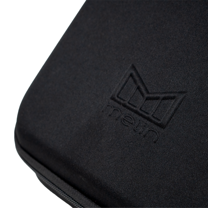A close up view of the Melin logo on the 3 Hat Travel case in black