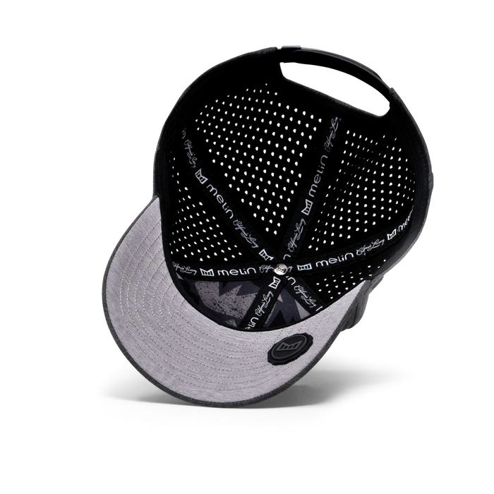 The inside view of the Melin Vintage Fit A-Game Hydro hat in dark grey