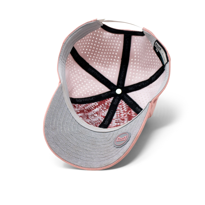 The inside view of the Melin Vintage Fit A-Game Hydro hat in pink