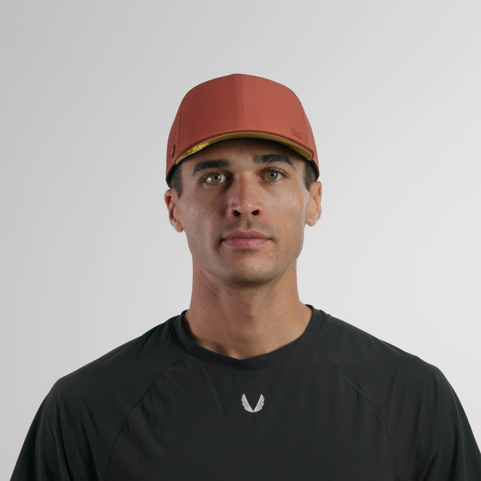 The model-image of the melin Vintage Fit A-Game Hydrolite hat in burnt brick