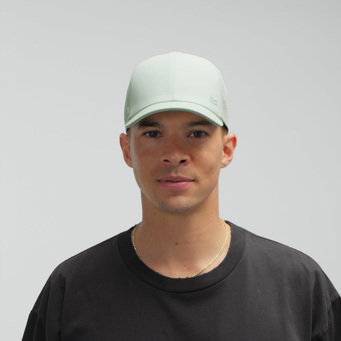The model-image of the melin Vintage Fit A-Game Hydrolite hat in dusty mint