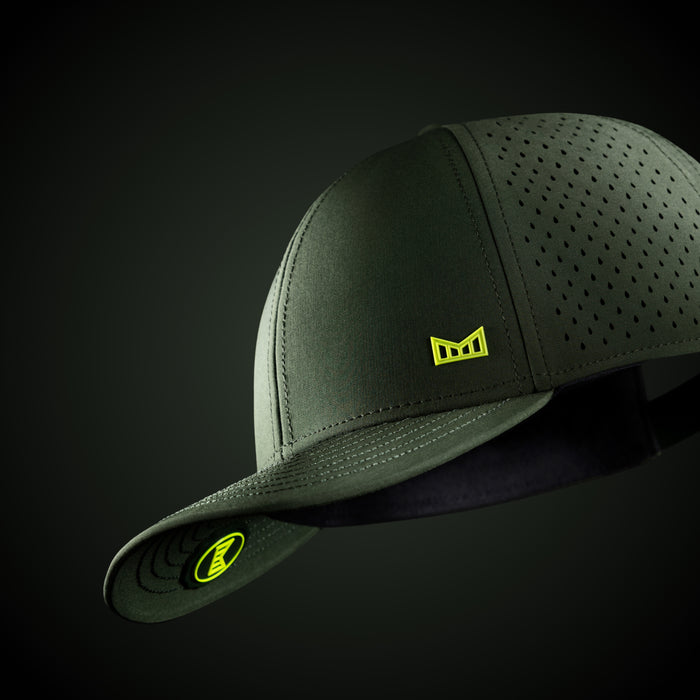 The studio image of the A-Game Icon Hydro in Kombu Green against a green background