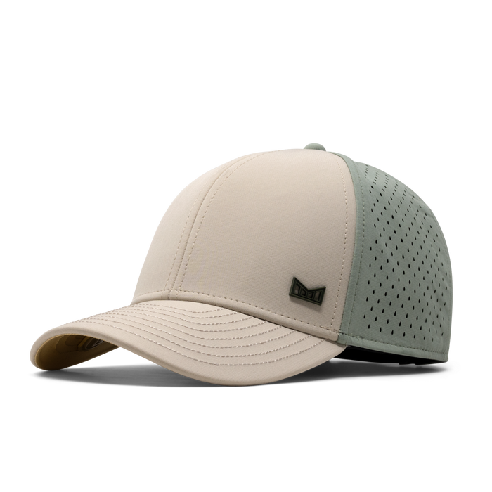 The front, angled view of the melin A-Game Icon Hydro Vintage Fit in Sandshell