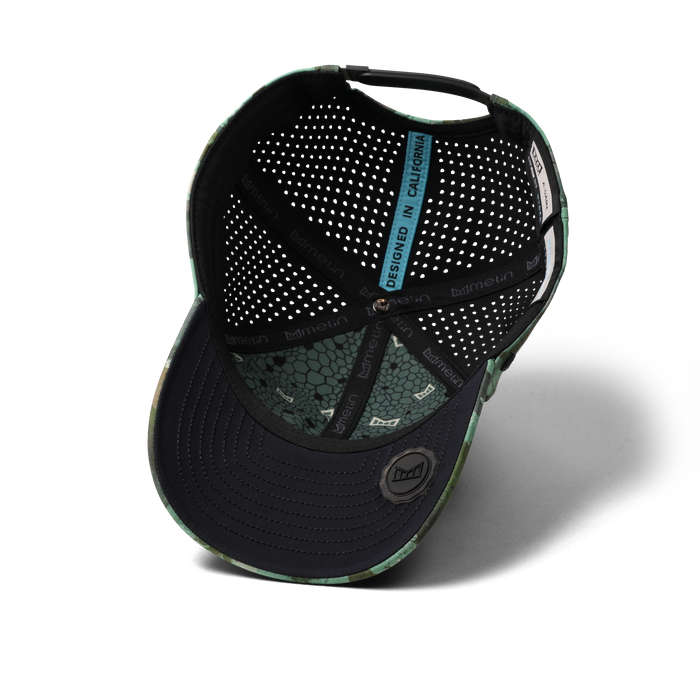 The inside view of the melin Vintage Fit A-Game Icon Hydro hat in watercolor camo