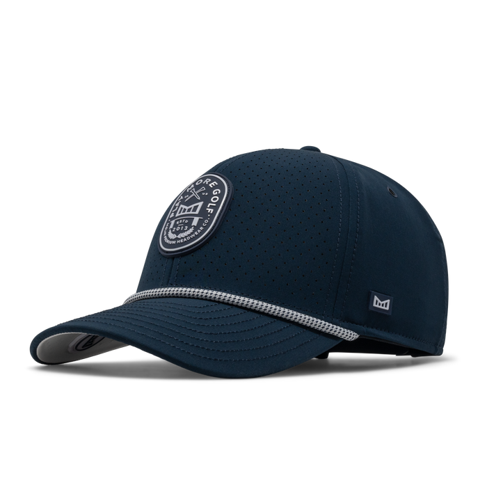 The front, angled view of the melin A-Game Links Drive Hydro  Vintage Fit in  Navy / White