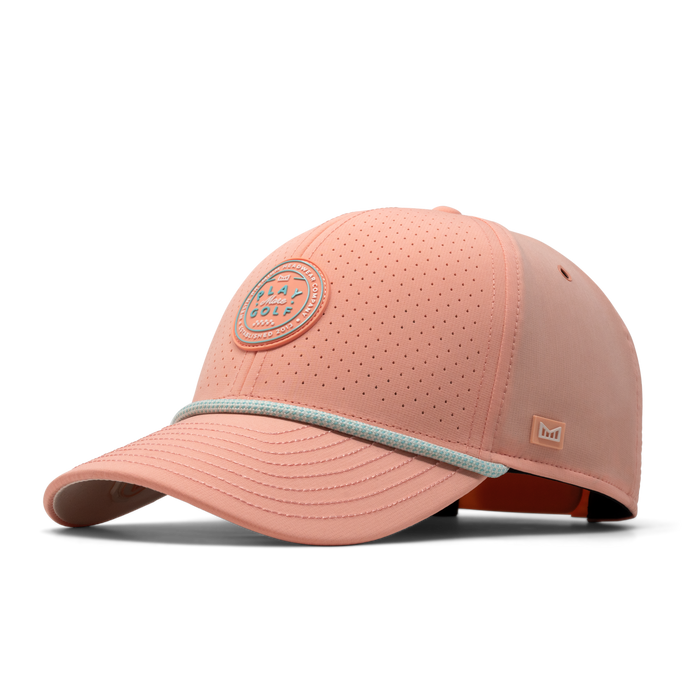 The front, angled view of the melin A-Game Links Hydro  Vintage Fit in  Peach Nectar