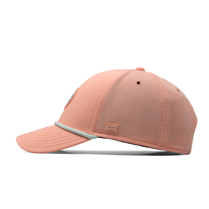 The side view of the melin A-Game Links Hydro  Vintage Fit in  Peach Nectar