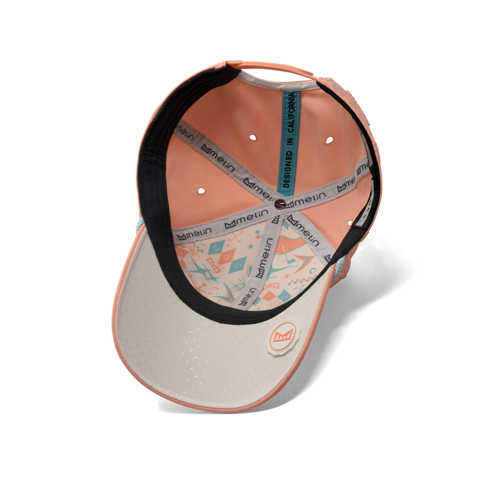 The inside view of the melin A-Game Links Hydro  Vintage Fit in  Peach Nectar
