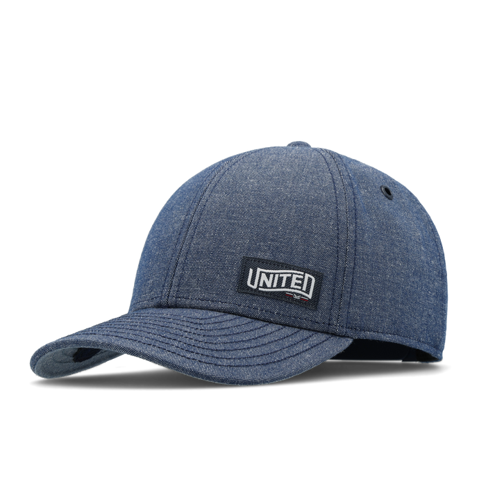 The front, angled view of the melin A-Game Mill United  Vintage Fit in  Chambray