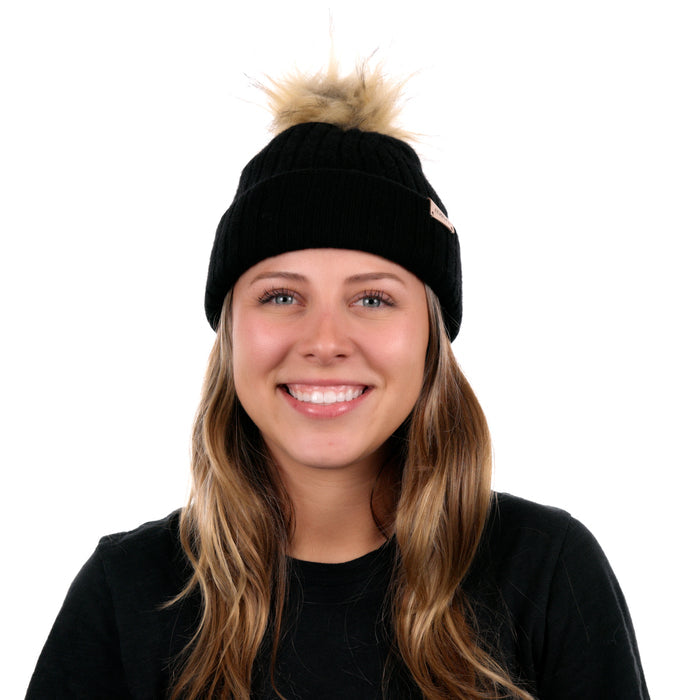 The model-image of the Melin All-Day Pom Beanie in black