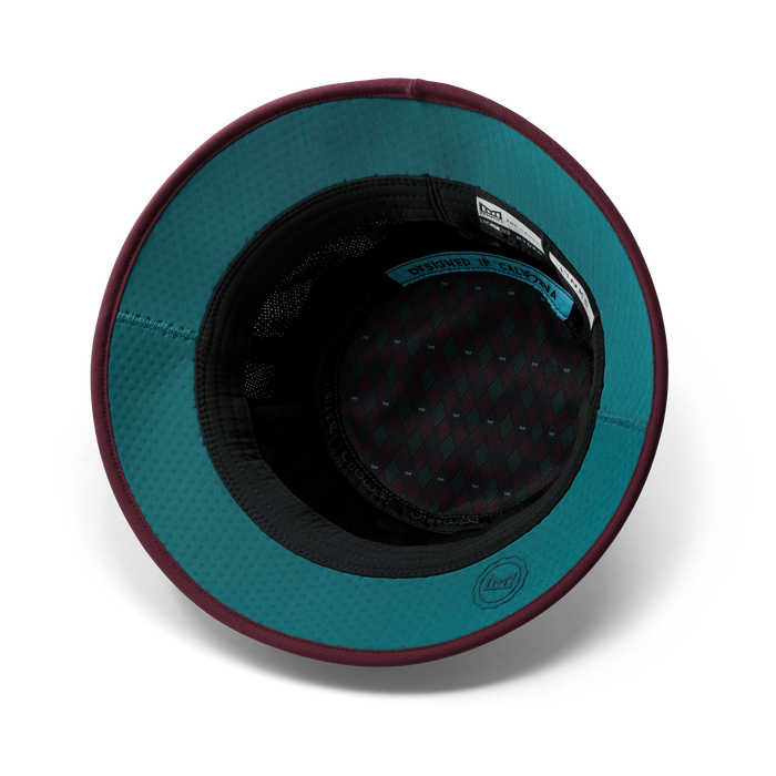 The back view of the melin Bucket Hat Caddy Links Clubhouse Hydro in grandeur