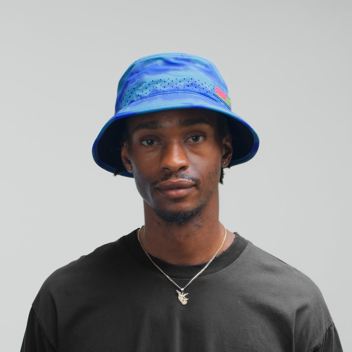 The model-image of the Crushed Fit Caddy Neon Tie Dye Hydro Bucket Hat in Electric Blue