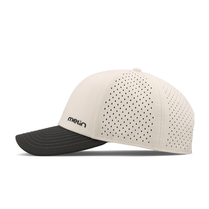 The side view of the melin Compass Hydro Vintage Wide Fit in Moonbeam / Pirate Black