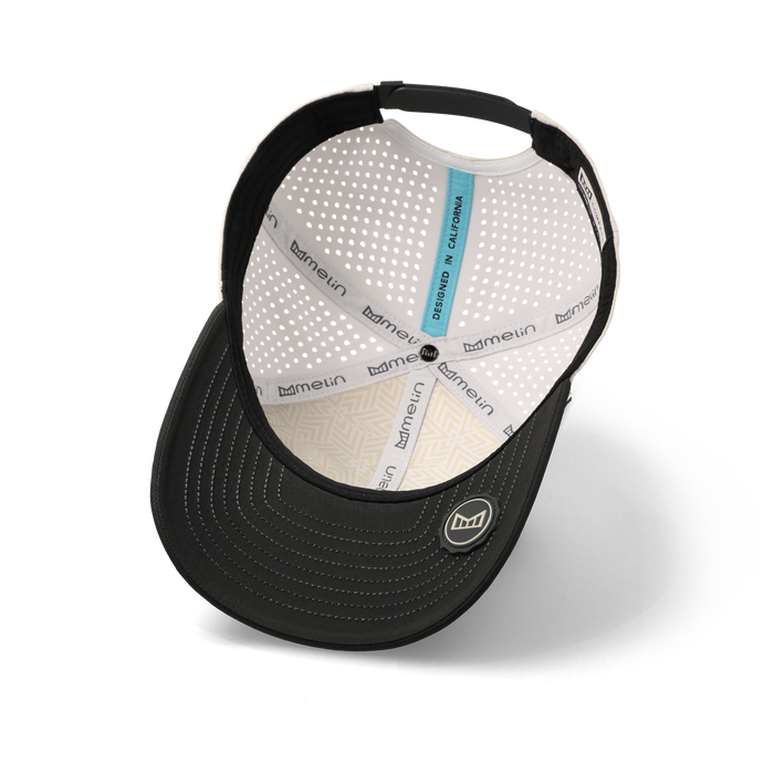 The inside view of the melin Compass Hydro Vintage Wide Fit in Moonbeam / Pirate Black