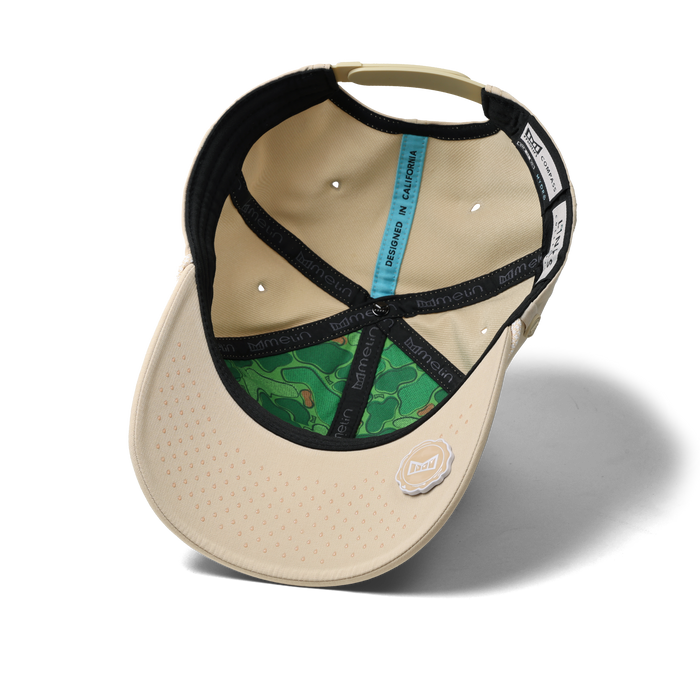 The inside view of the melin Vintage Fit Compass Links Hydro hat in khaki