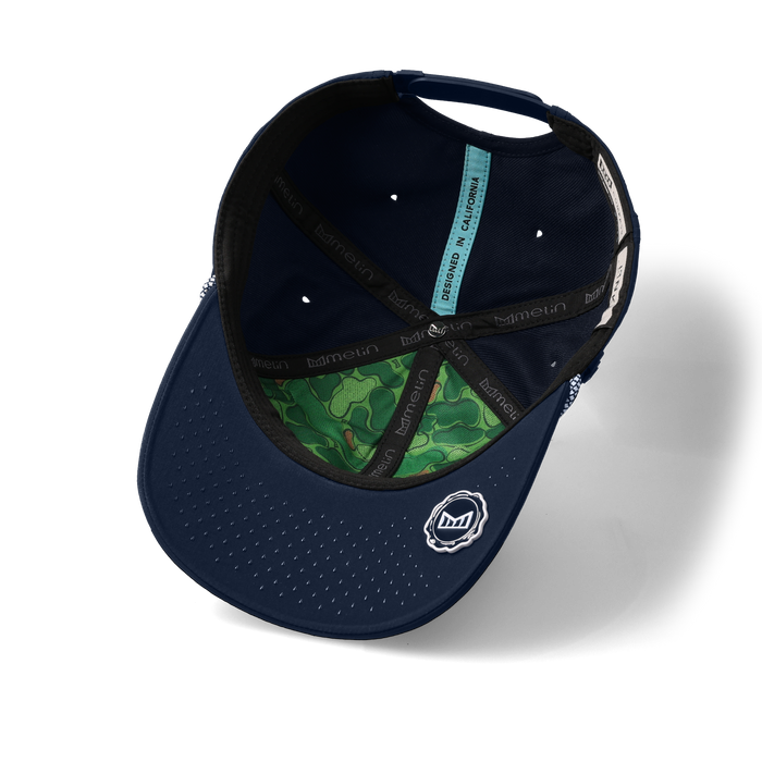 The inside view of the melin Vintage Fit Compass Links Hydro hat in navy
