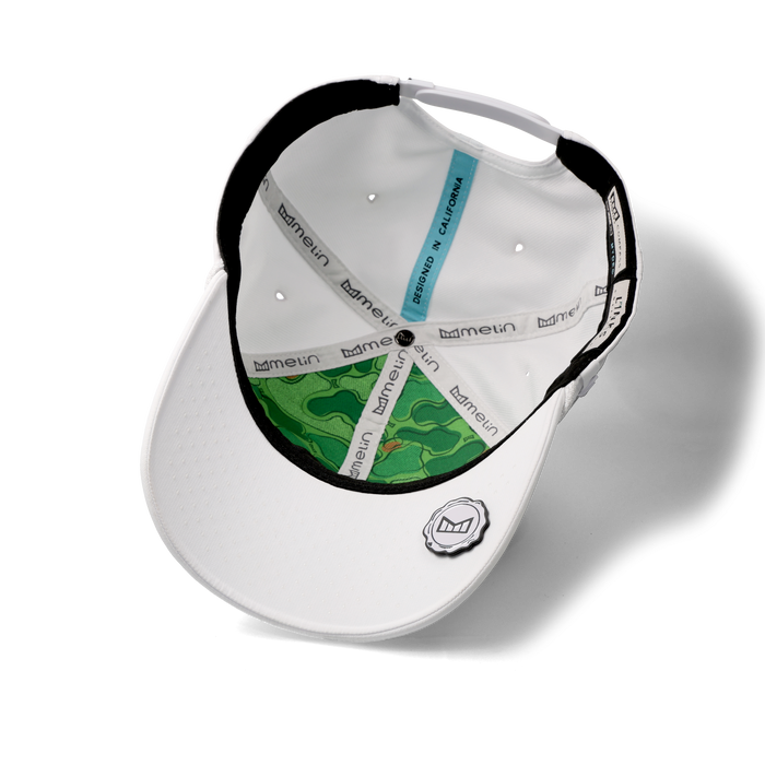 The inside view of the melin Vintage Fit Compass Links Hydro hat in white