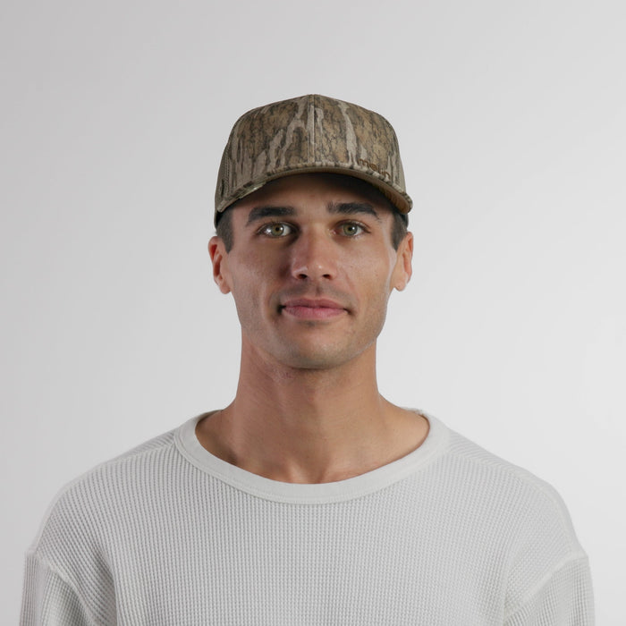 The model-image of the melin Vintage Fit Compass Mossy Oak Hydro hat in Bottomland