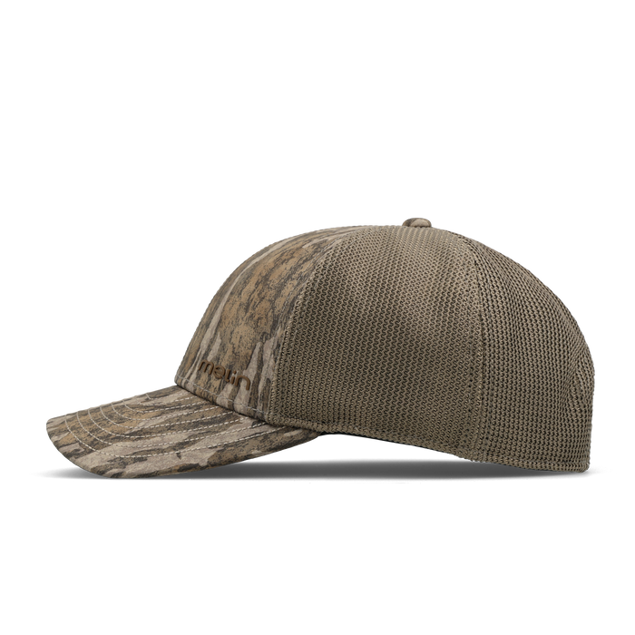 The side view of the melin Vintage Fit Compass Mossy Oak Hydro hat in Bottomland