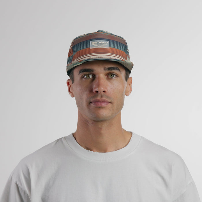The model-image view of the melin Split Crushed Fit Coronado Brick Hydro hat in Picante