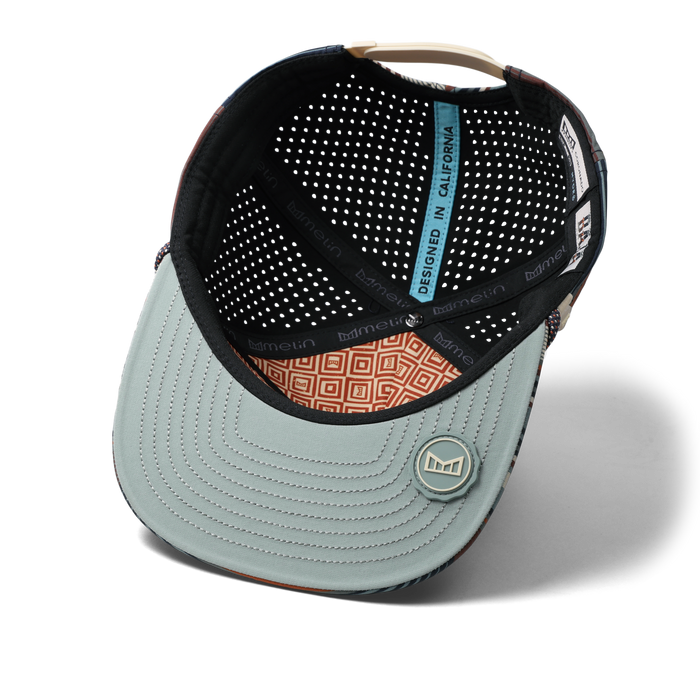 The inside view of the melin Split Crushed Fit Coronado Brick Hydro hat in Picante
