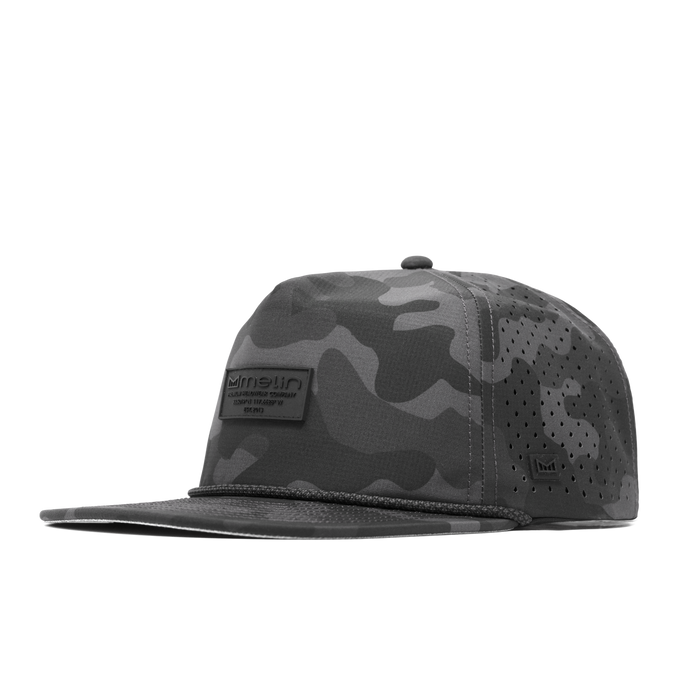 The front, angled view of the melin Coronado Brick Hydro  Split Crushed Fit in  Black Camo