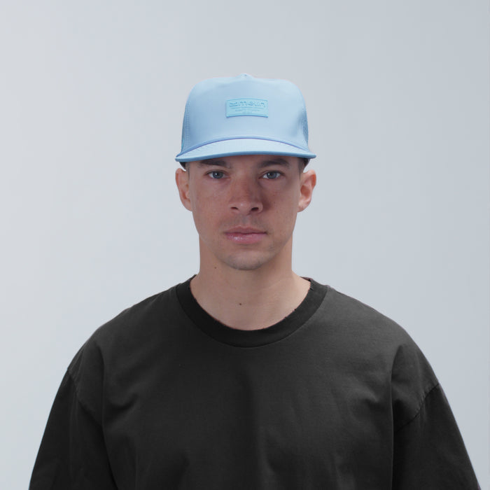 The model-image view of the melin Split Fit Coronado Hydro hat in Cashmere Blue