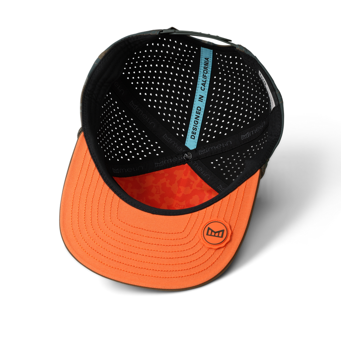 Black and orange baseball cap with perforated mesh back and blue interior label showing "Designed in California."