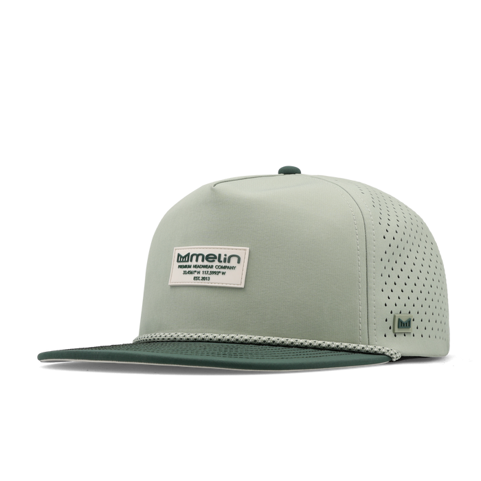 The angled view of the melin Split Crushed Fit Coronado Brick Hydro hat in misty trails