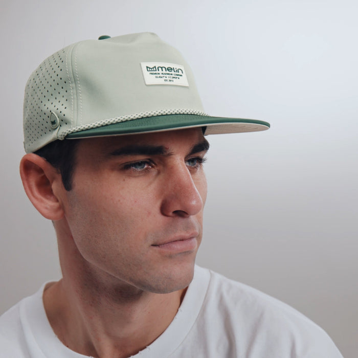 The model-image view of the melin Split Crushed Fit Coronado Brick Hydro hat in misty trails