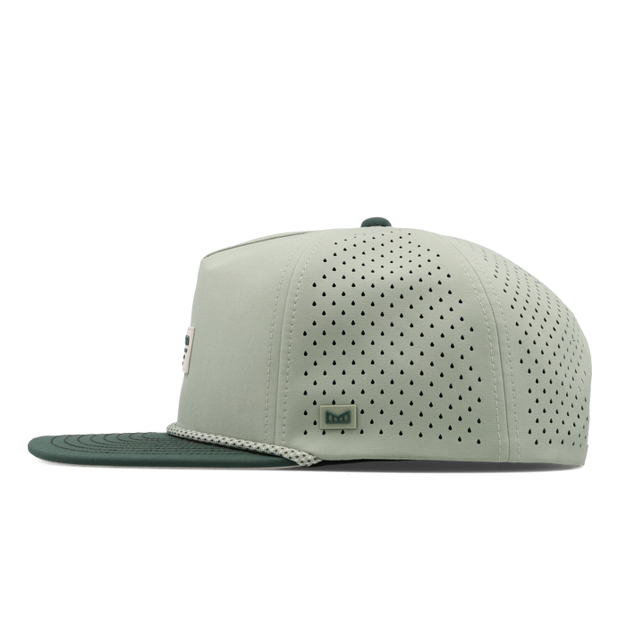 The side view of the melin Split Crushed Fit Coronado Brick Hydro hat in misty trails