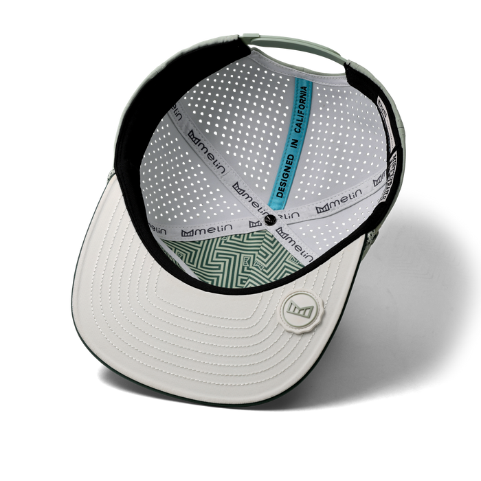 The inside view of the melin Split Crushed Fit Coronado Brick Hydro hat in misty trails