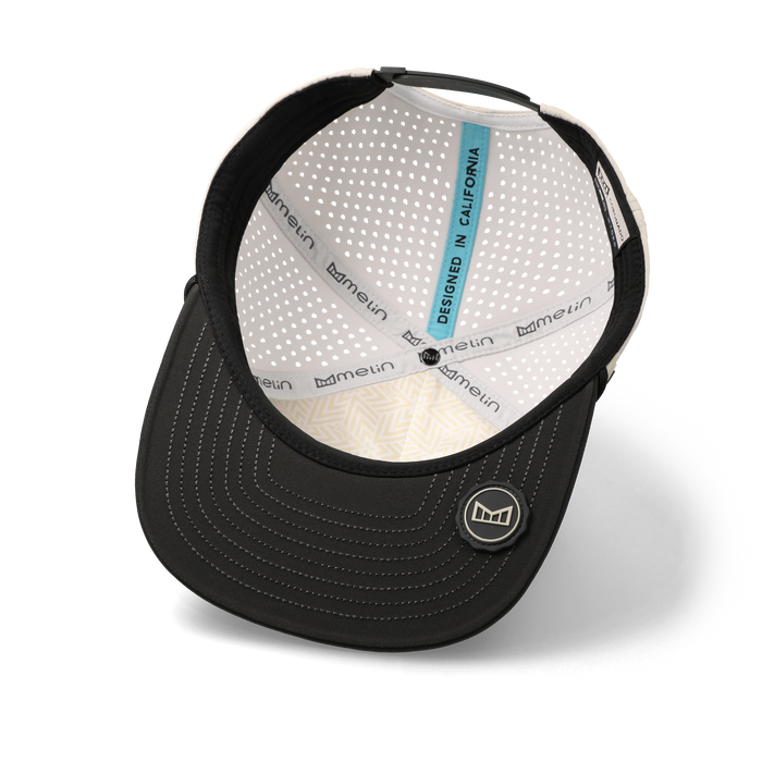 The inside view of the melin Coronado Brick Hydro Split Crushed Fit in Moonbeam / Pirate Black
