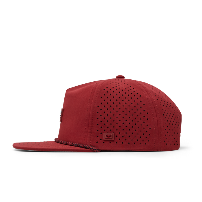 The side view of the melin Coronado Brick Hydro  Split Crushed Fit in  Red