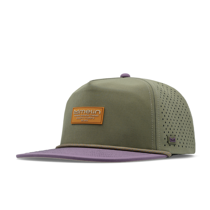 The front, angled view of the melin Split Crushed Fit Coronado Brick Hydro hat in transit