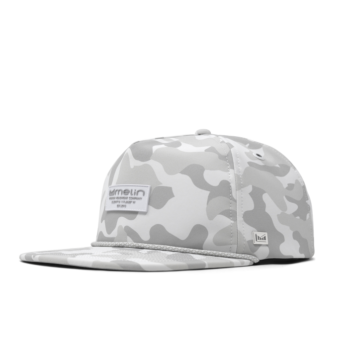 The front, angled view of the melin Coronado Brick Infinite Thermal  Split Crushed Fit in Snow Camo