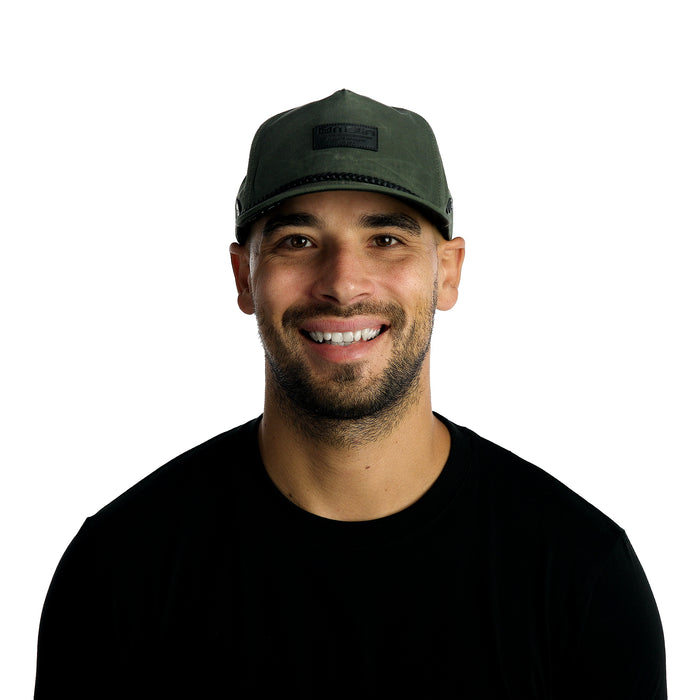 The model-image of the Melin Split Fit Coronado Brick Thermal hat in Surplus