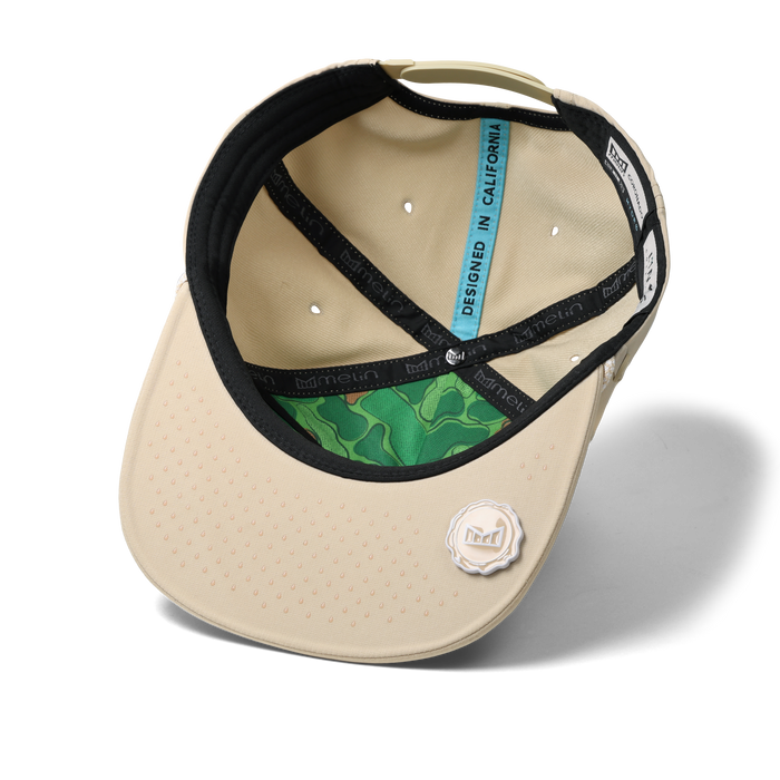 The inside view of the melin Split Crushed Fit Coronado Links Hydro hat in khaki