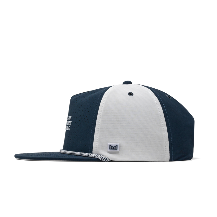 The side view of the melin Coronado Links Drive Hydro  Split Crushed Fit in  Navy / White