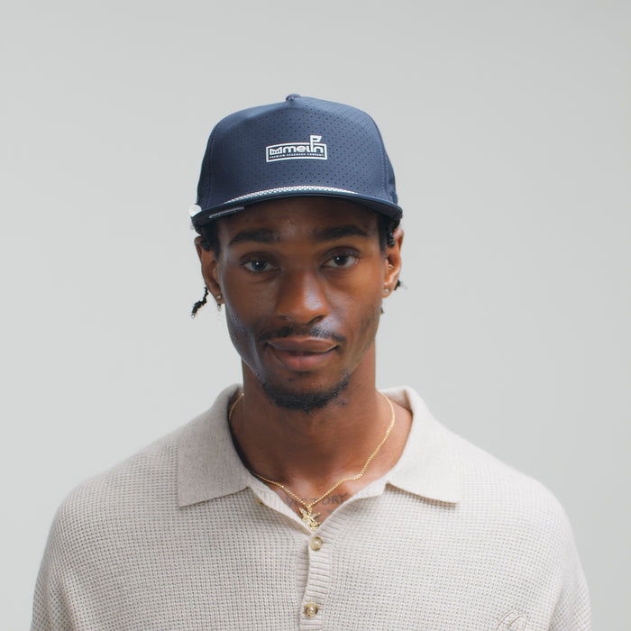 The model-image of the melin Split Crushed Fit Coronado Links Hydro hat in navy