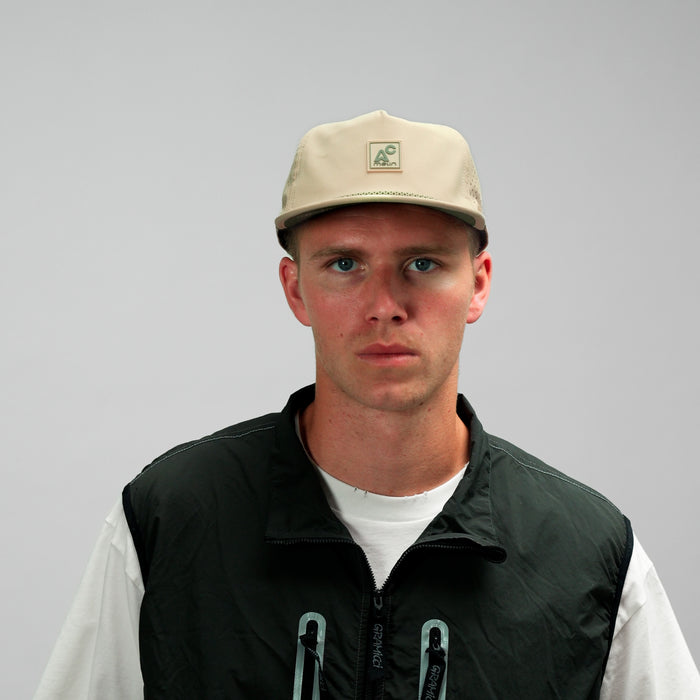 The model-image of the Melin Split Crushed Fit Coronado Packable Hydro hat in Sand