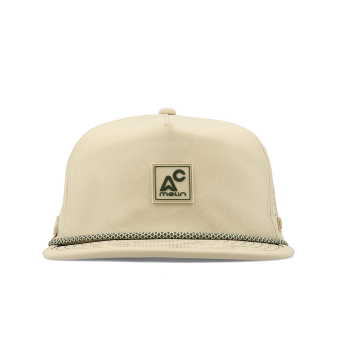 The frontal view of the melin Split Crushed Fit Coronado Packable Hydro hat in sand