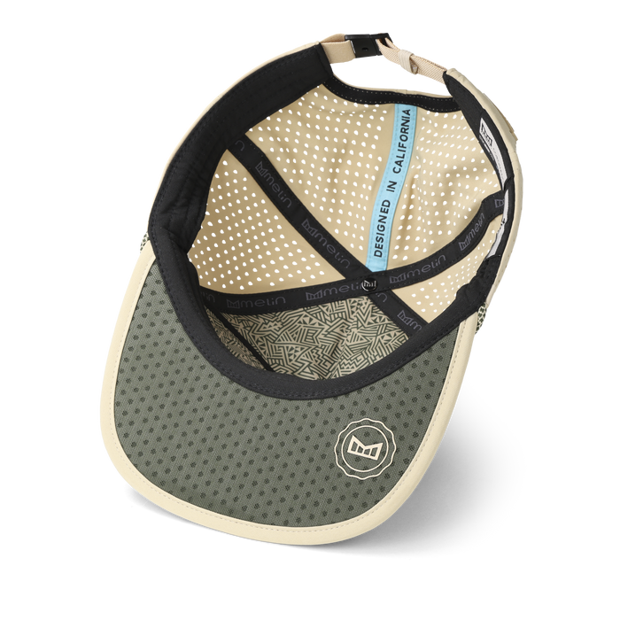 The inside view of the melin Split Crushed Fit Coronado Packable Hydro hat in sand