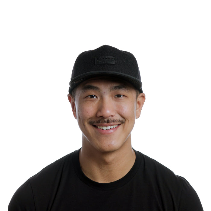 The model-image of the Melin Split Crushed Fit Coronado Scout Thermal hat in Black