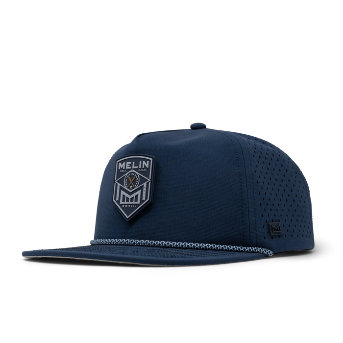 The front, angled view of the melin Coronado Shield Hydro  Split Crushed Fit in  Navy