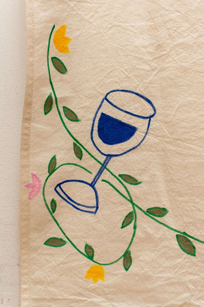 Hand-painted wine glass, vines and flowers detail