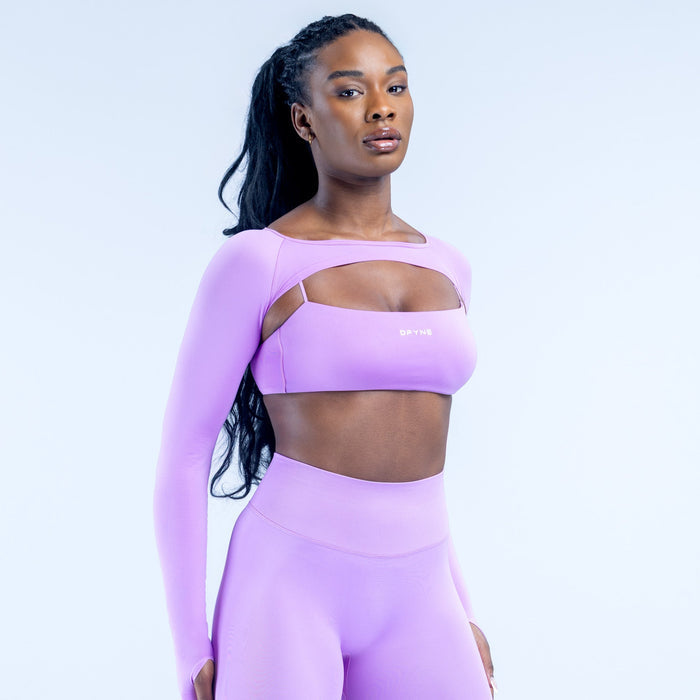 Lavender long-sleeve shrug over sports bra with wide neckline and fitted torso
