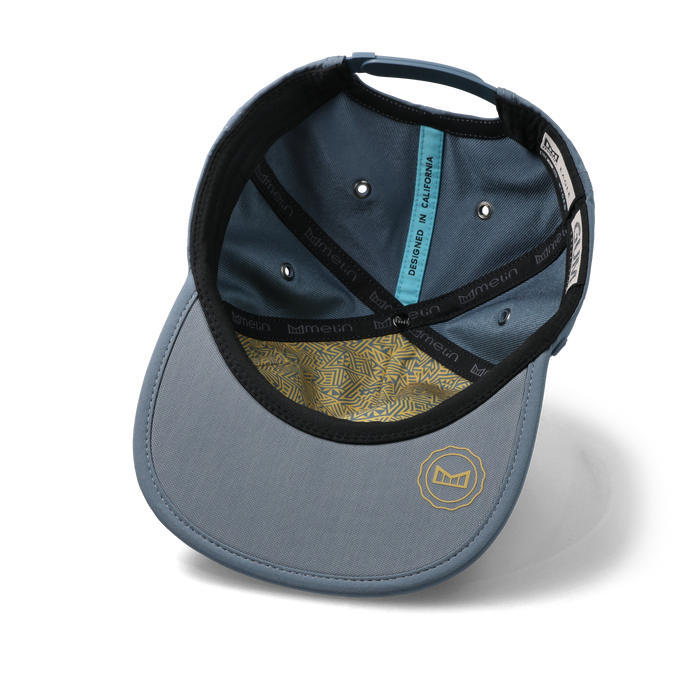 The inside view of the melin Split Crushed Fit Eagle Hydro hat in blue stone / gum