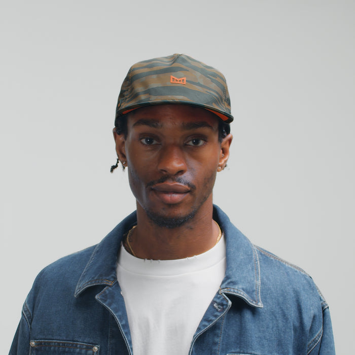 The model-image view of the melin Split Crushed Fit Eagle Hydro hat in Everglade Camo