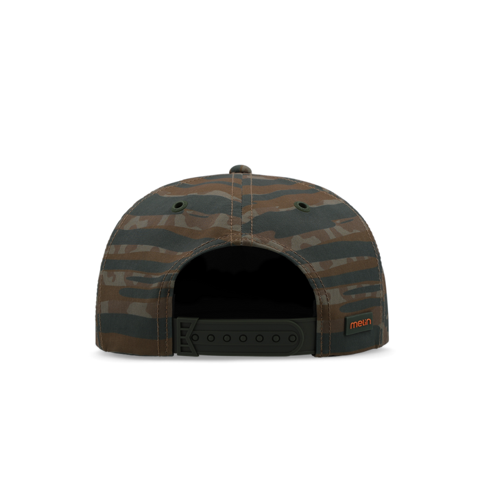 Brown and charcoal striped camouflage baseball cap with snap closure and orange brand label on side.
